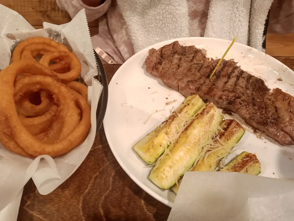 Steak with Onions Rings and Zucchini Sticks